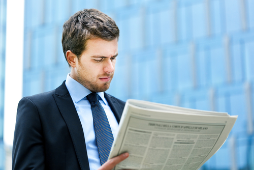 Man reading newspaper